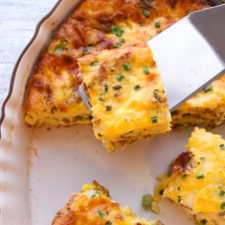 Breakfast casserole being served from platter