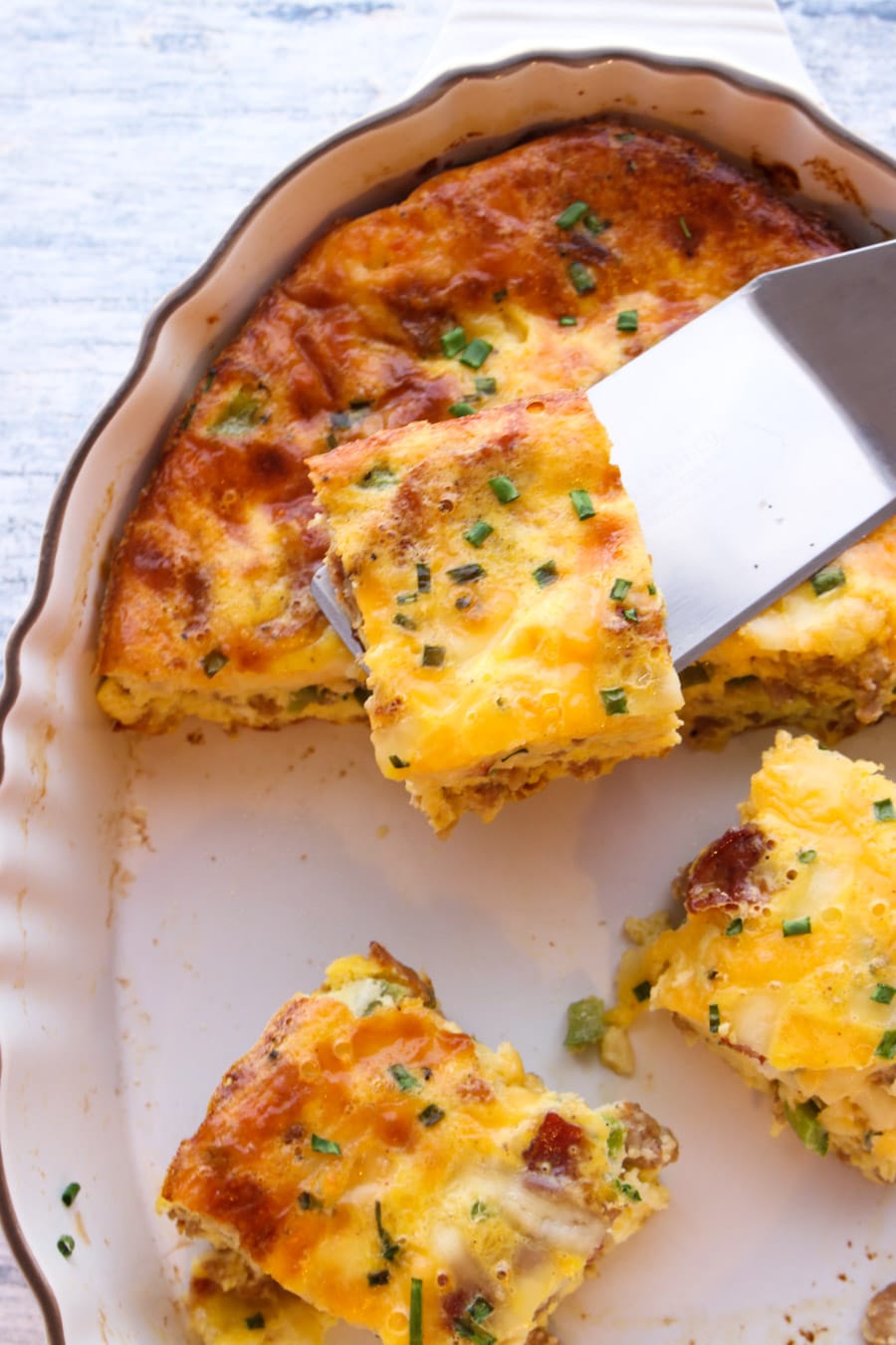 Breakfast casserole being served from platter