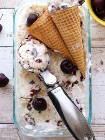 scoop of ice cream with cones in container