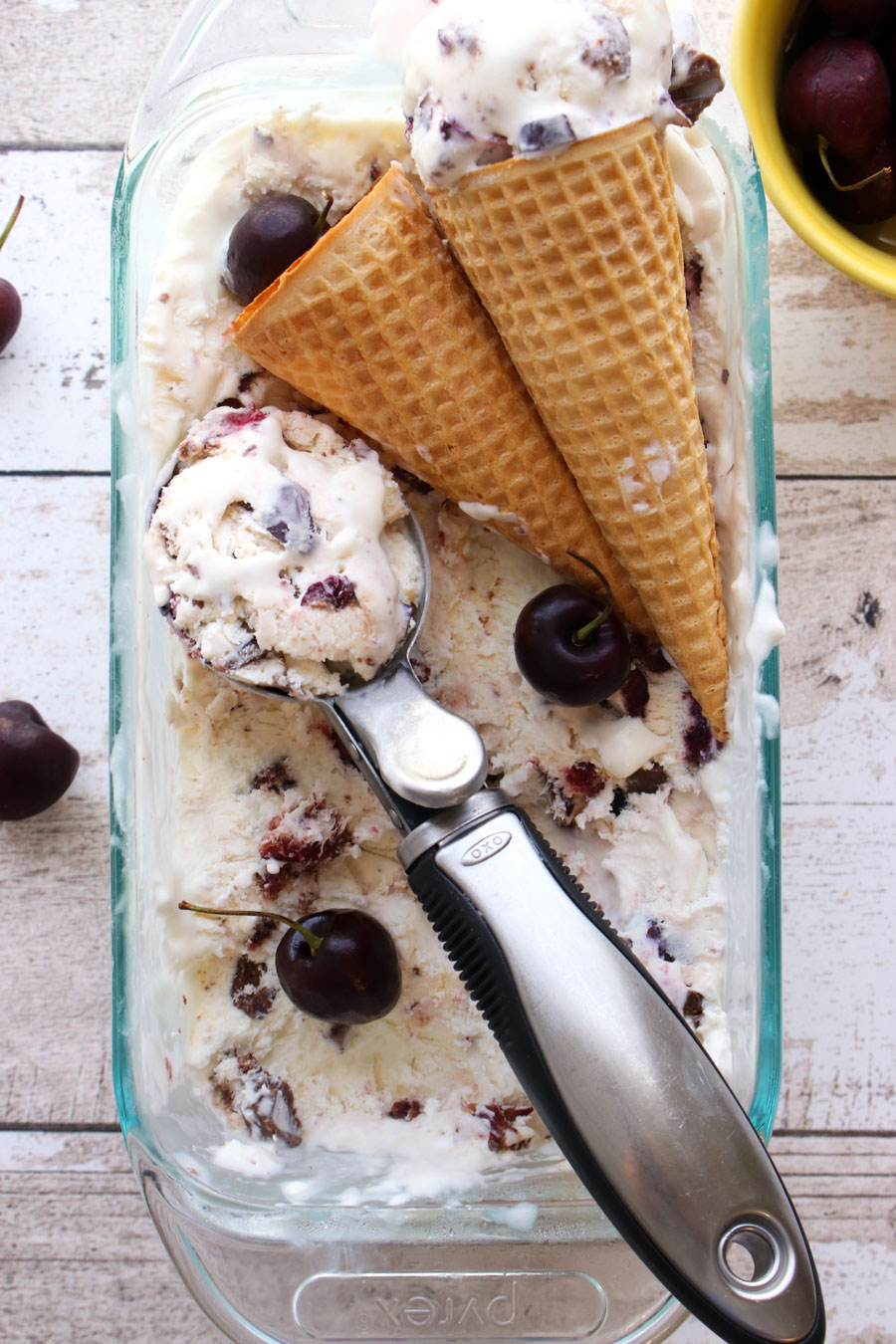 scoop of ice cream with cones in container