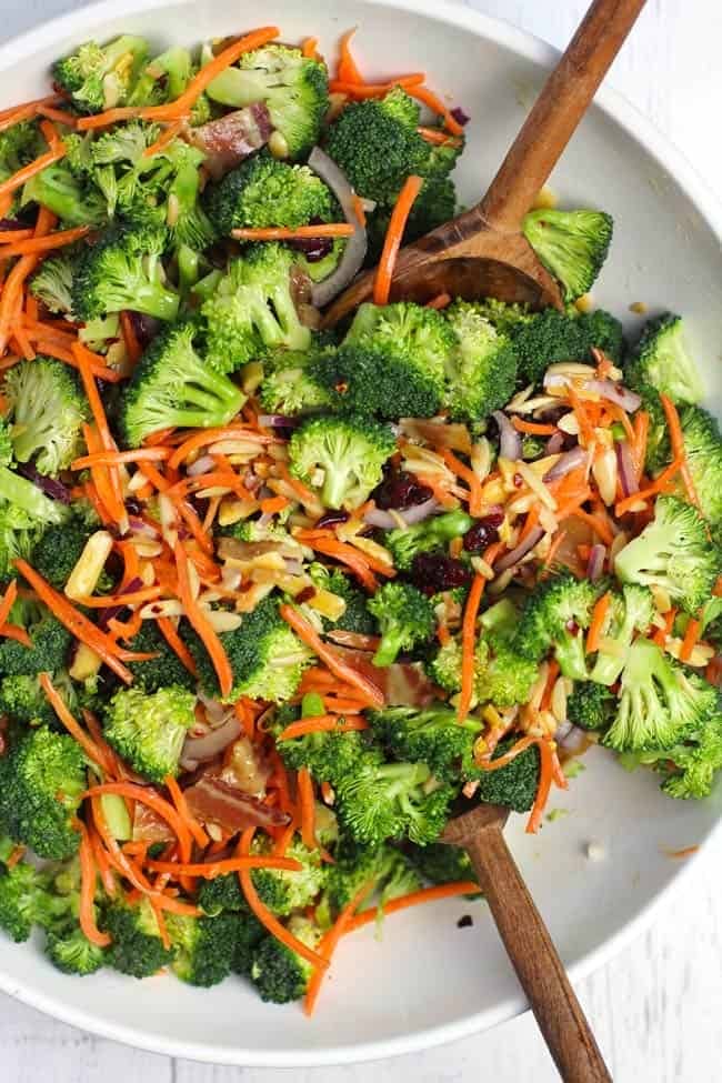 A plate of broccoli salad with carrots 