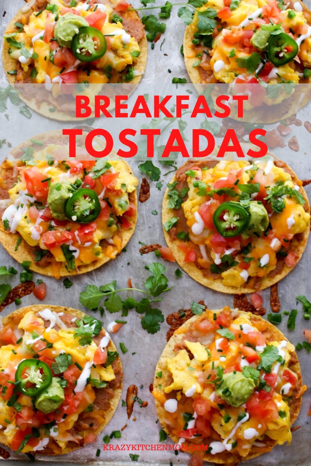 Huevos Rancheros Breakfast Tostadas is a great recipe for breakfast, lunch, or dinner. They're made with creamy refried beans, fluffy scrambled eggs with melted cheese, diced tomatoes, diced, onions, guacamole, sour cream, cilantro, and jalapeños. via @krazykitchenmom