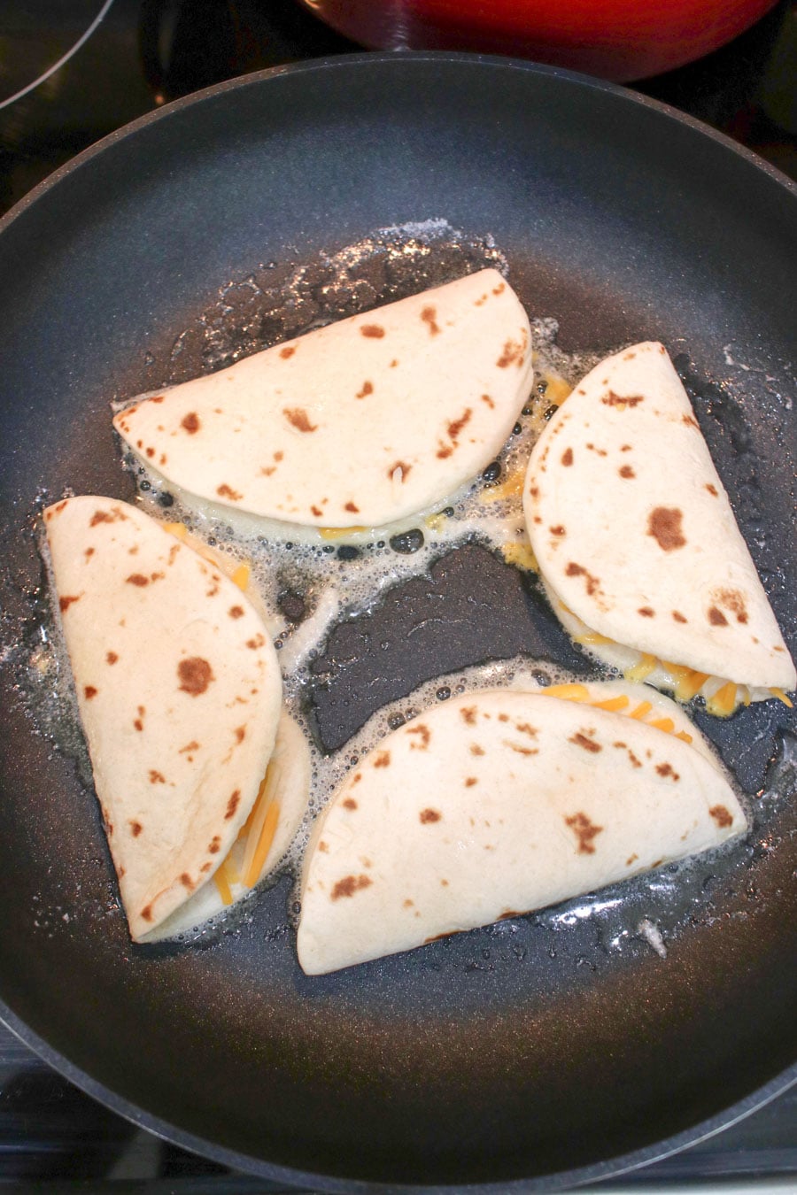 folded quesadillas cooking