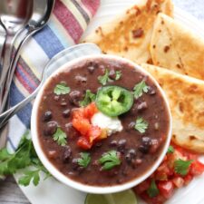 Bowl of black bean soup with quesdillas