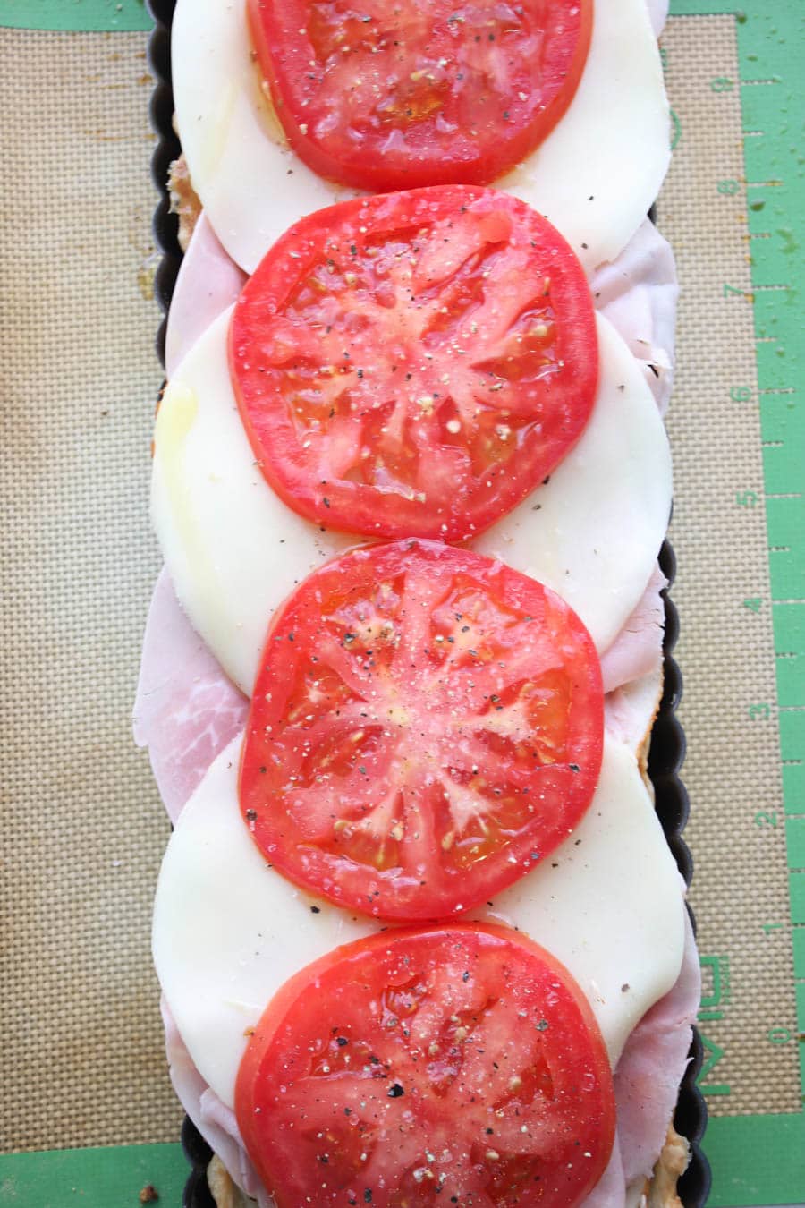 Top tart with tomato slices