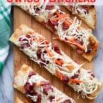 three pieces of Flatbread on a thin cutting board