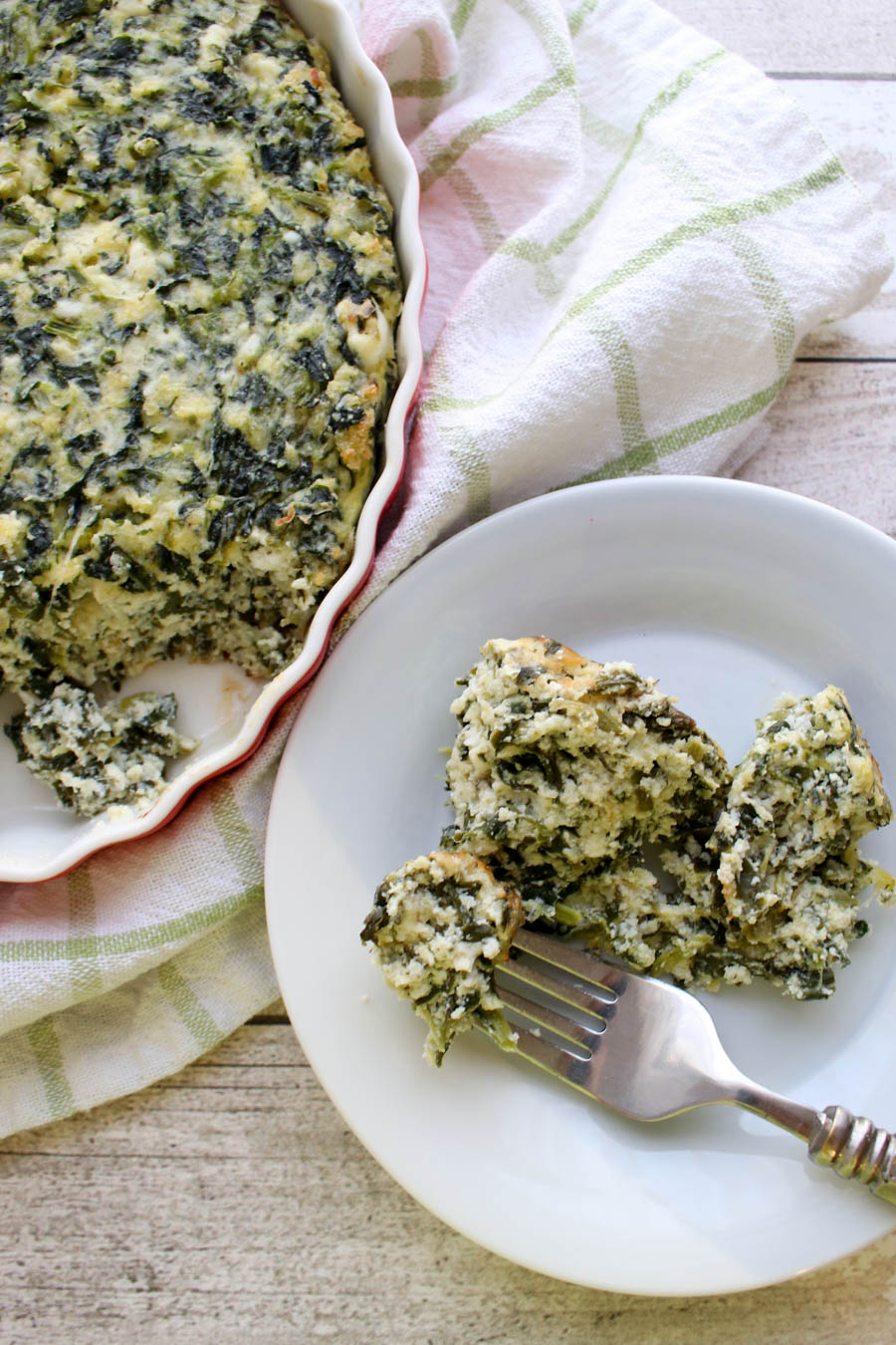 Spinach Pie in casserole dish with a side serving