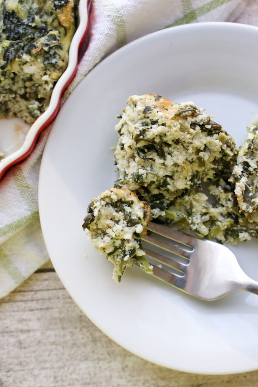 close up shot of spinach pie on a fork