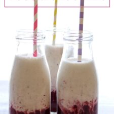 three bottles of smoothie with stripped straws