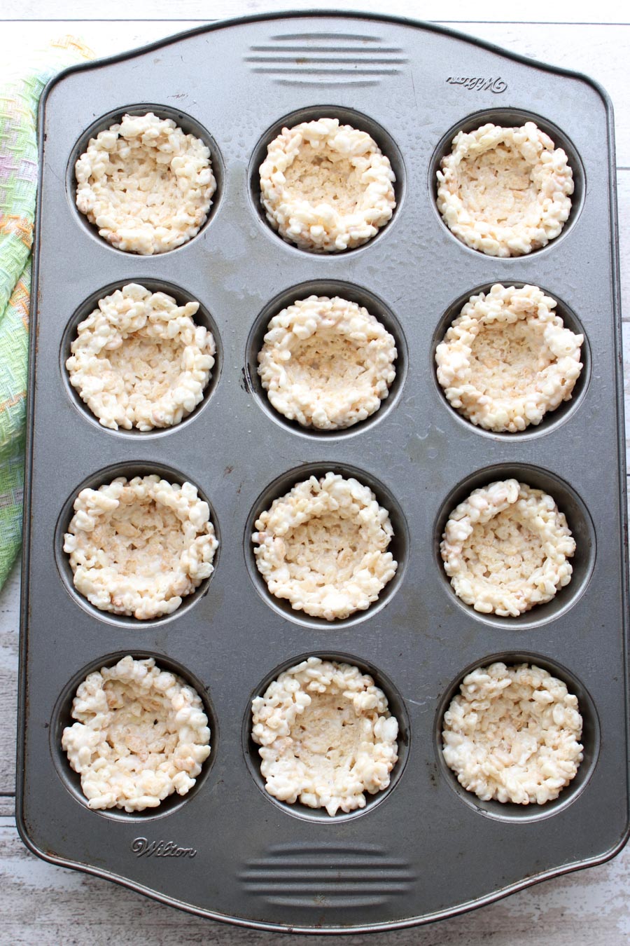 Forming the treat balls into the tin