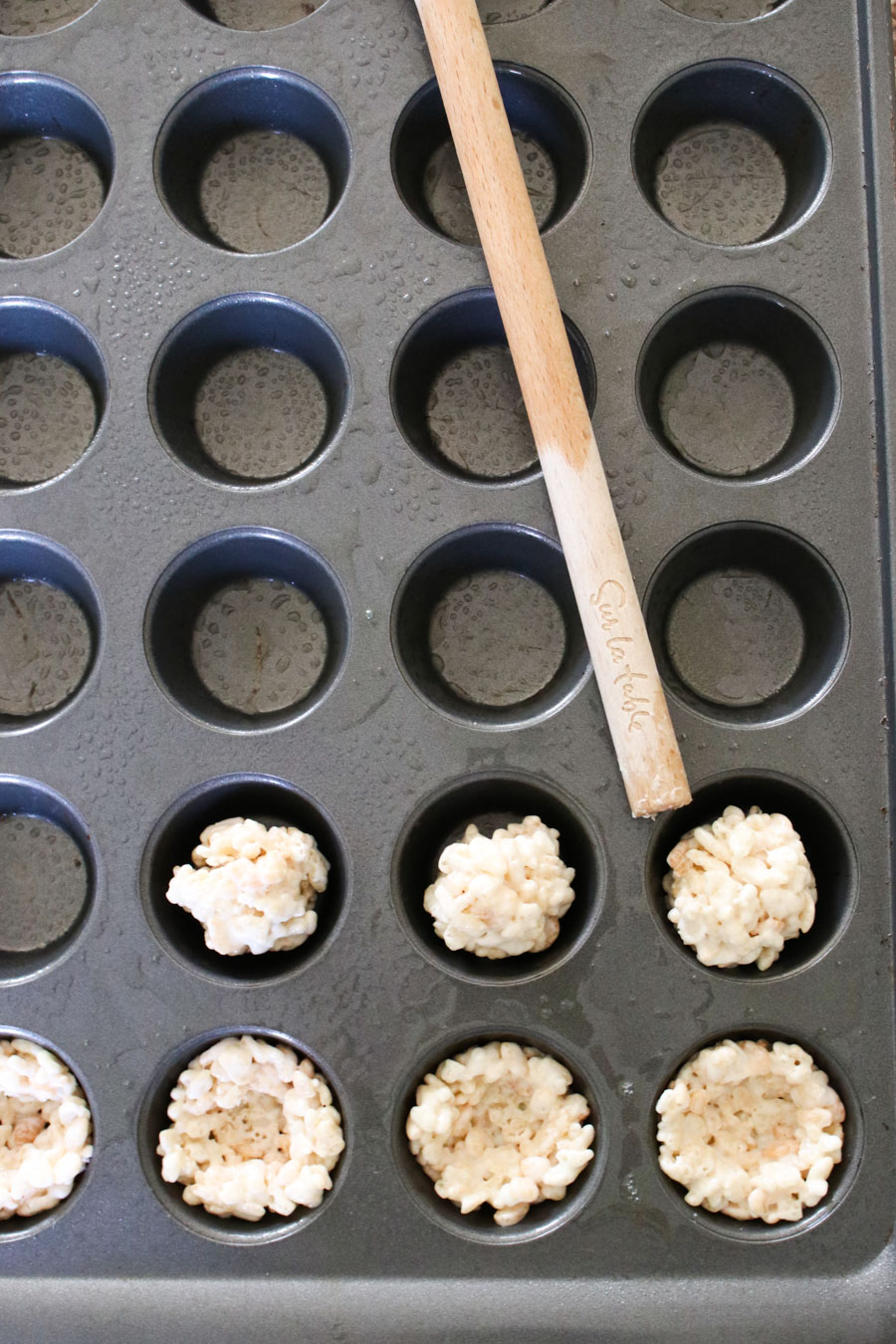 Forming the treat balls into the tin