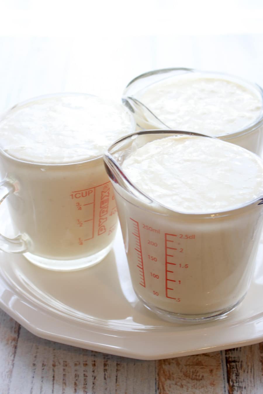 white cake mix in three 1 cup measuring cups