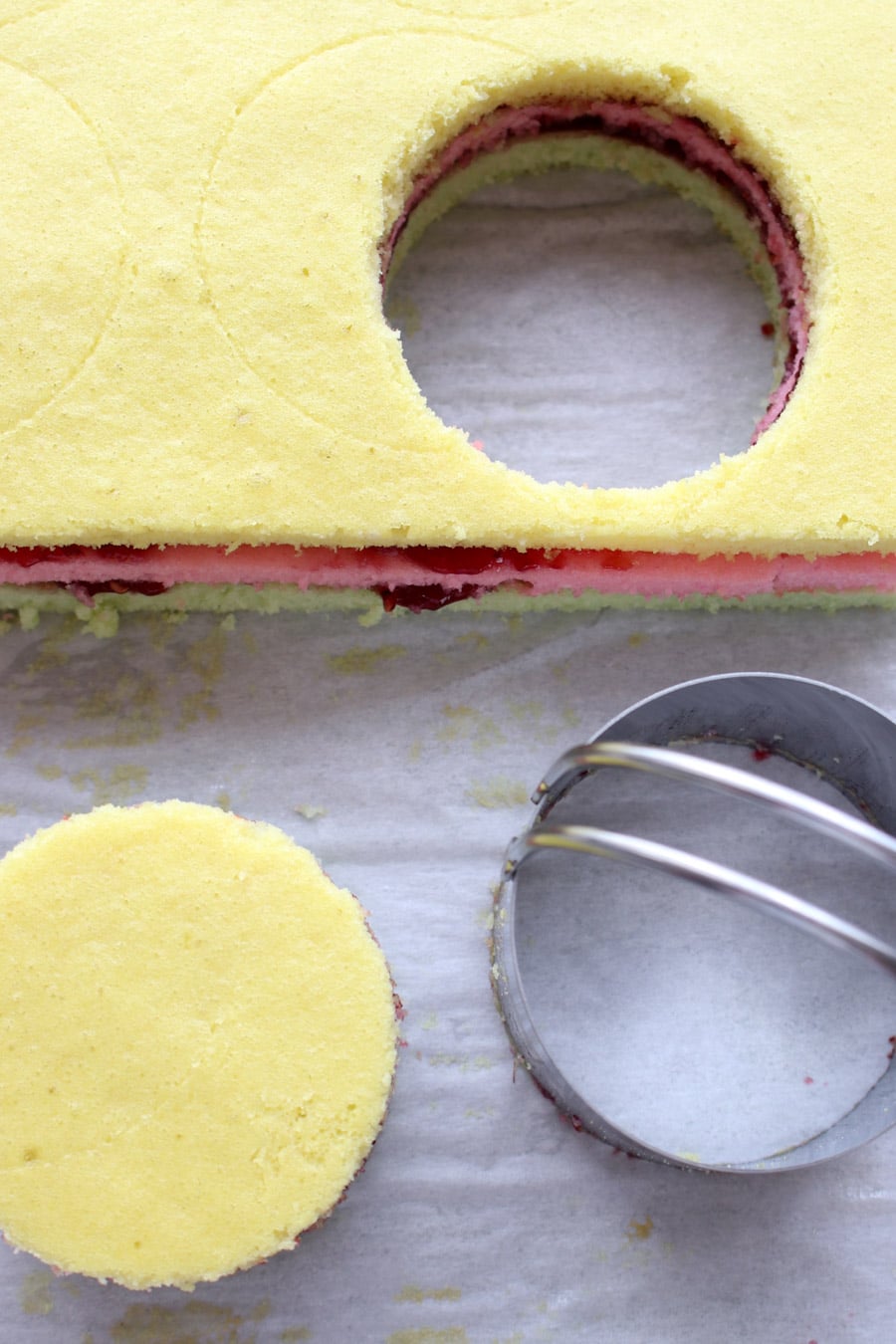 Colored cake stacks cut into a circle with a biscuit cutter