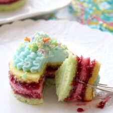 1 layered cake with a bite on a fork