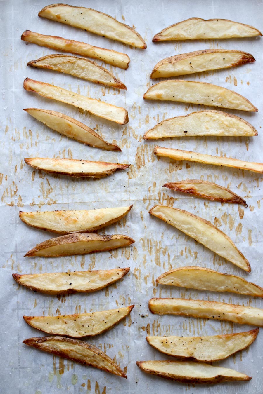 Baked french fries on a cookie sheet