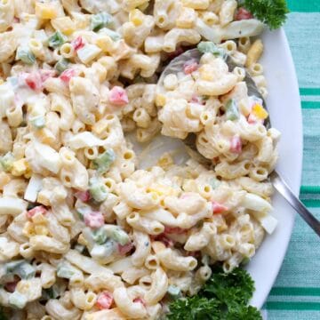 Platter of macaroni salad with a spoon