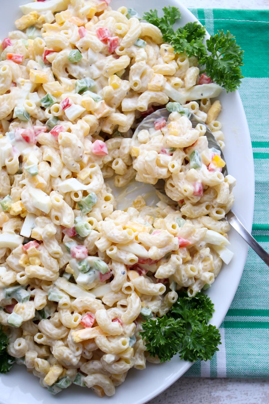 Platter of macaroni salad with a spoon