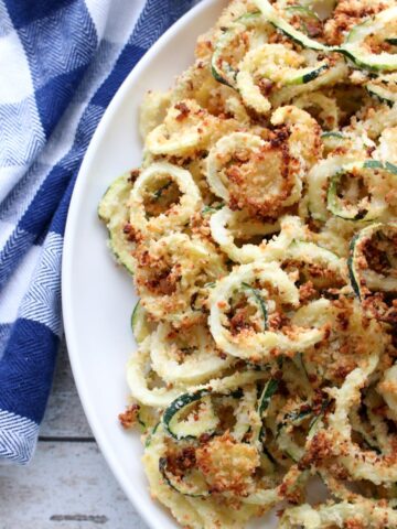 Large plate of zucchini curly fries