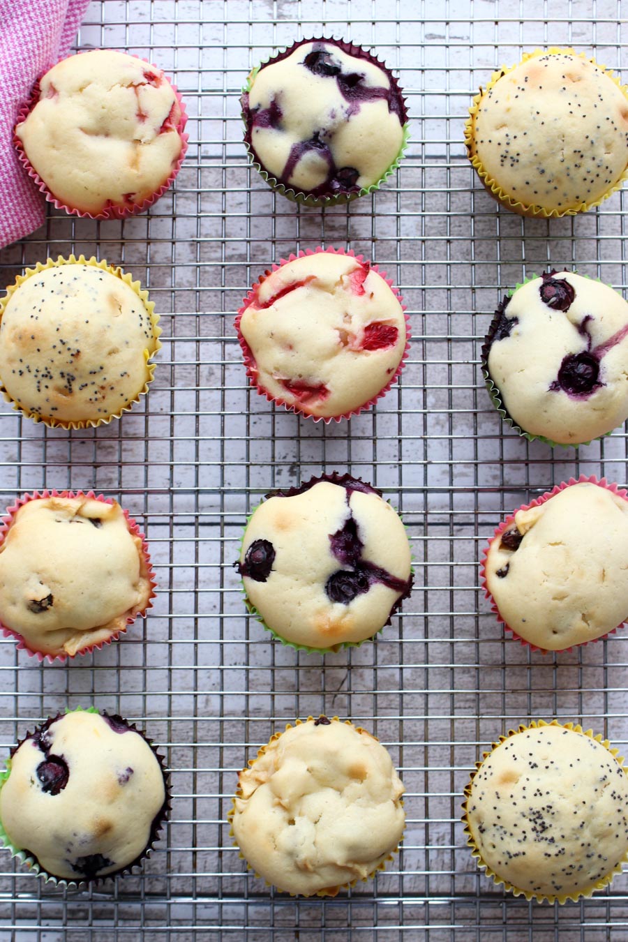 Assorted muffins on a cooling rack