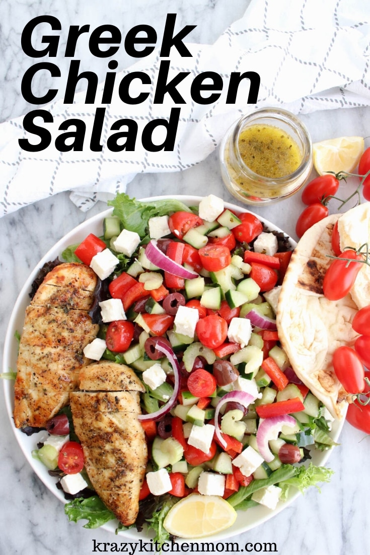 Greek Chicken Salad is made with leafy lettuce, feta cheese, olives, cucumbers, tomatoes, onion, bell peppers, and celery. It's topped with Greek seasoned grilled chicken and drizzled with Greek dressing. via @krazykitchenmom