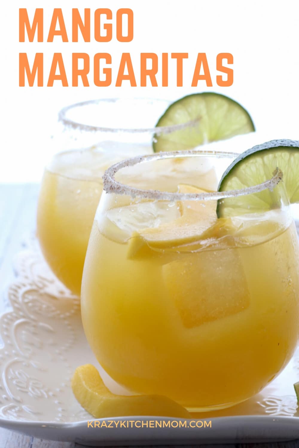 Simple Mango Margaritas are made with tequila, Cointreau, lime juice, and mango nectar. They are sweet, tangy, a  little bit spicy, and refreshing. via @krazykitchenmom