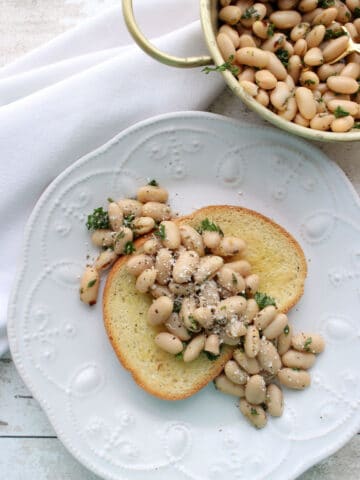 White bean salad on a slice of toast