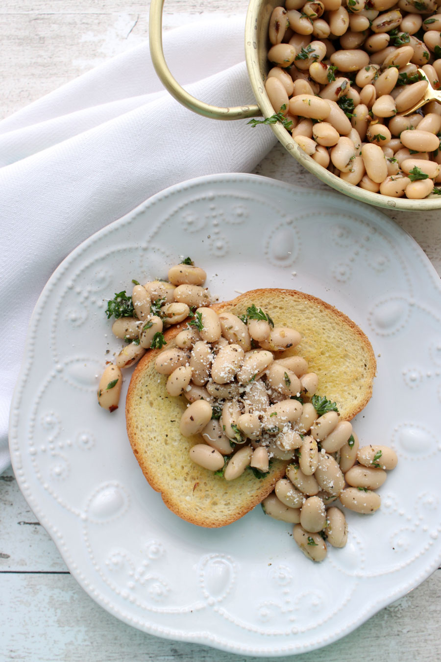 White bean salad on a slice of toast