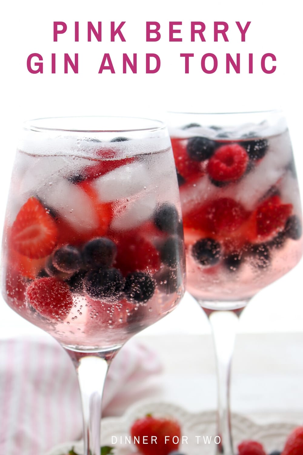 Pink Berry Gin and Tonic is a refreshing cocktail made with Pink Gin and filled with fresh strawberries, raspberries, and blueberries served over ice.  via @krazykitchenmom