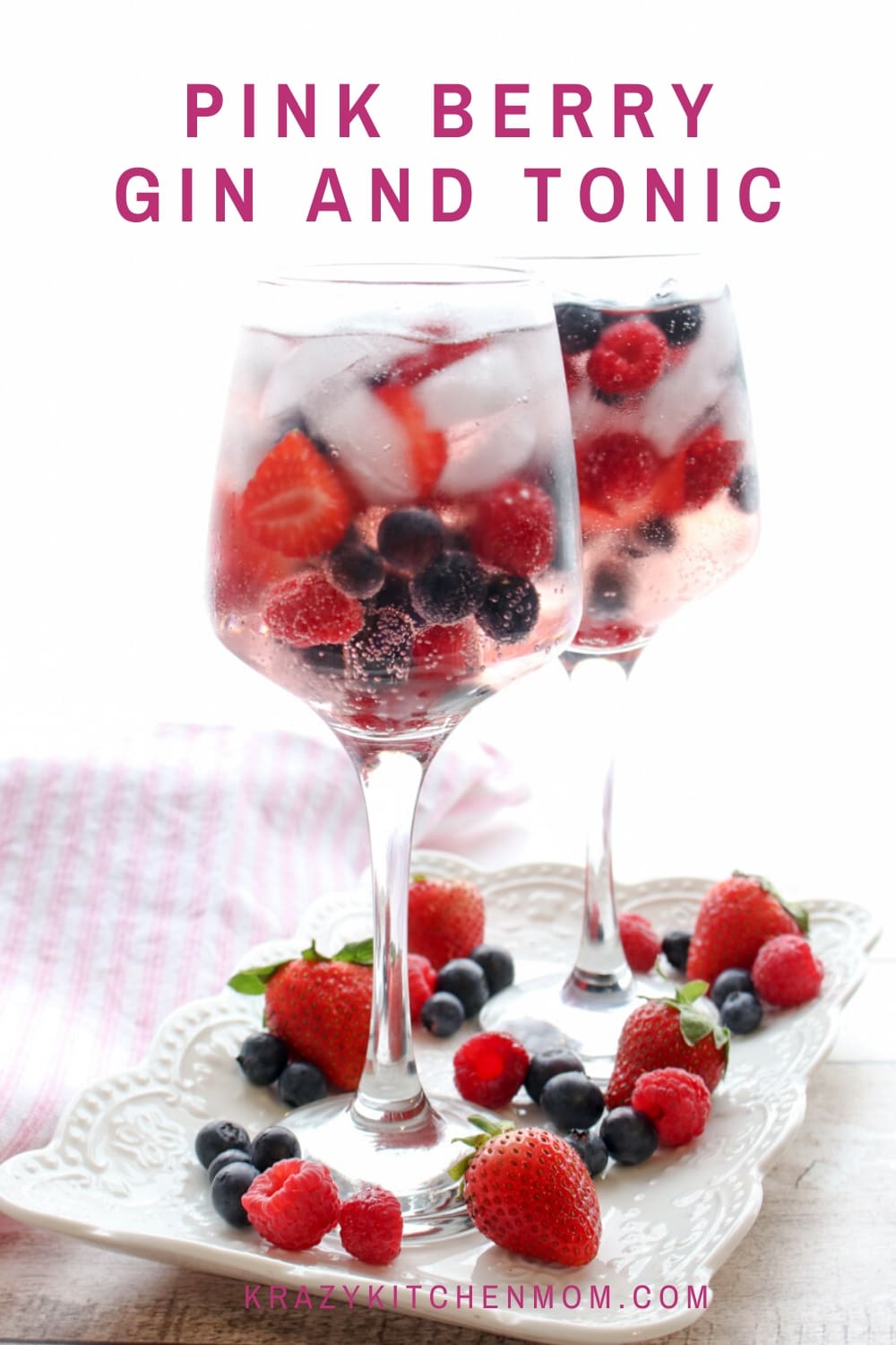 Pink Berry Gin and Tonic is a refreshing cocktail made with Pink Gin and filled with fresh strawberries, raspberries, and blueberries served over ice.  via @krazykitchenmom