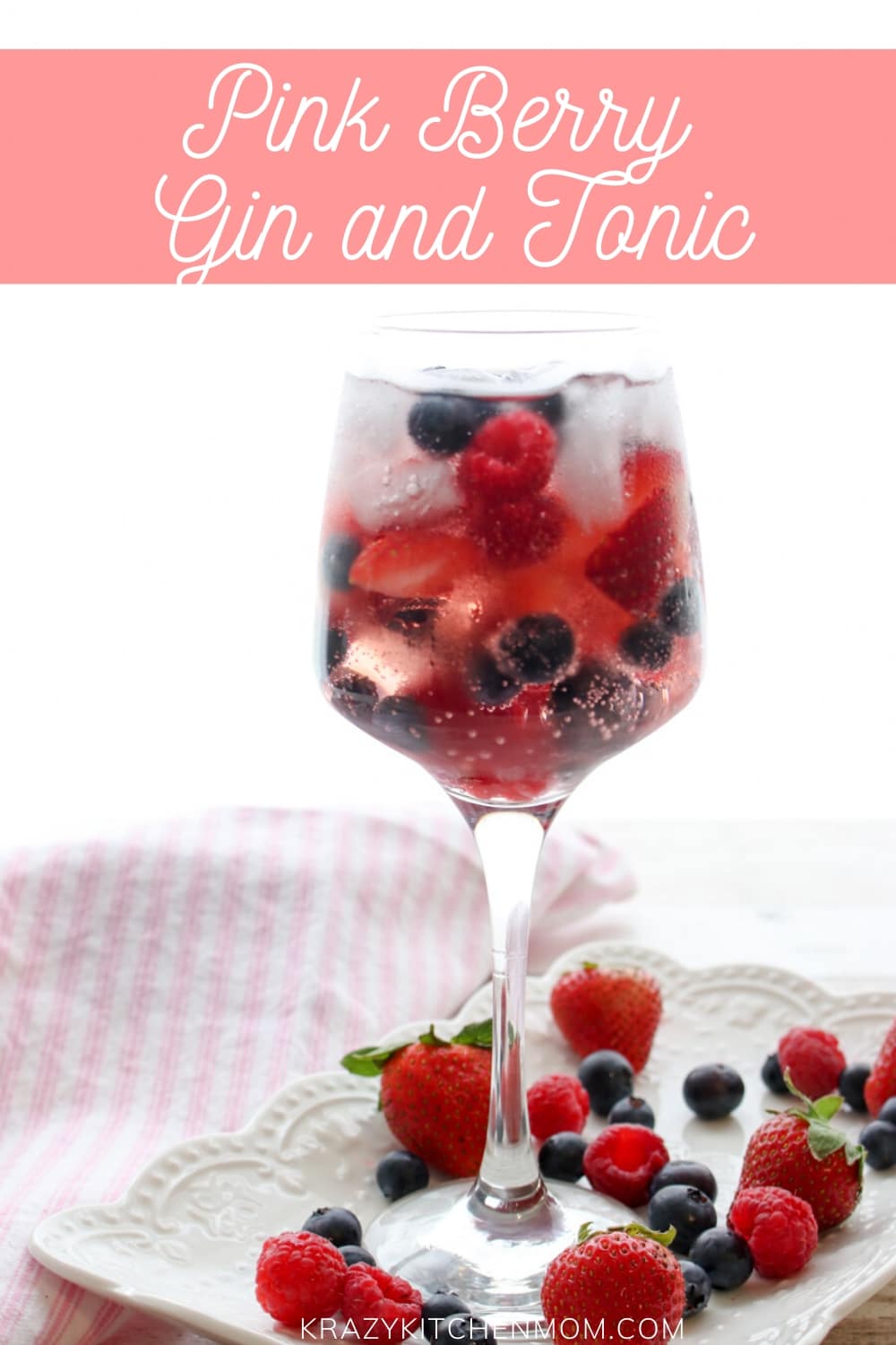 Pink Berry Gin and Tonic is a refreshing cocktail made with Pink Gin and filled with fresh strawberries, raspberries, and blueberries served over ice.  via @krazykitchenmom