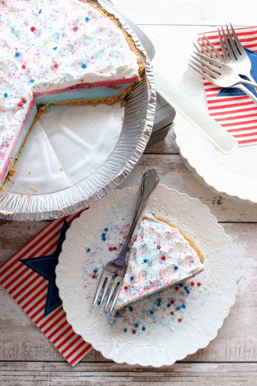 over head shot of one piece of pie from the whole no-bake red white blue yogurt jello pie