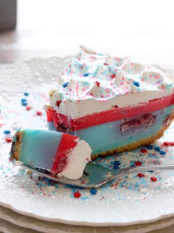 A slice with a fork full of Red White Blue Yogurt Jello Pie