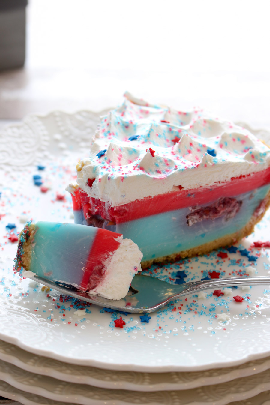 A slice with a fork full of Red White Blue Yogurt Jello Pie