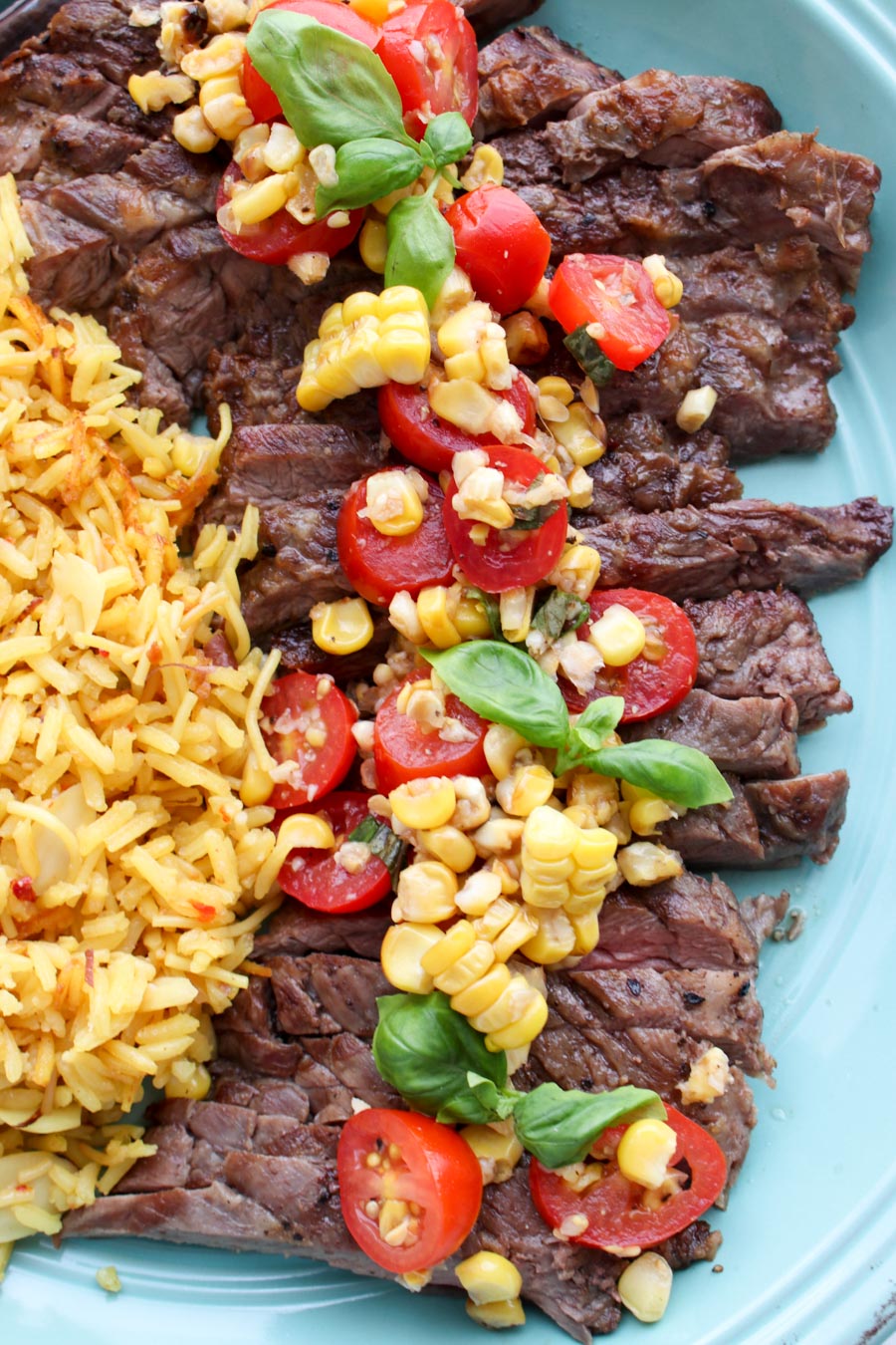 Platter with steak topped with salsa