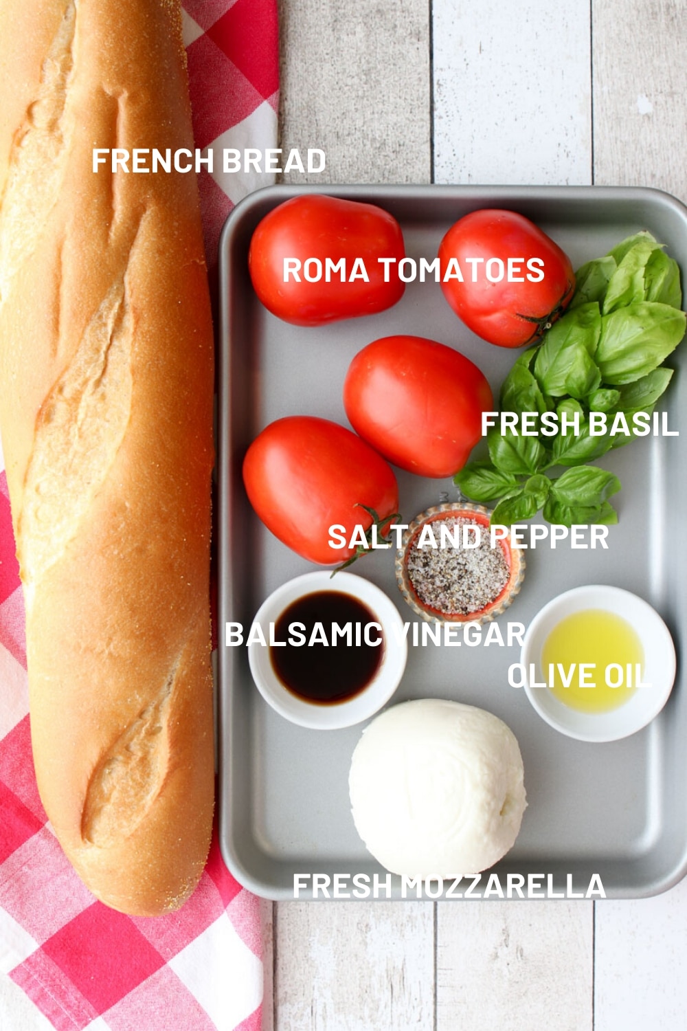 A tray with all of the ingredients to make bruschetta