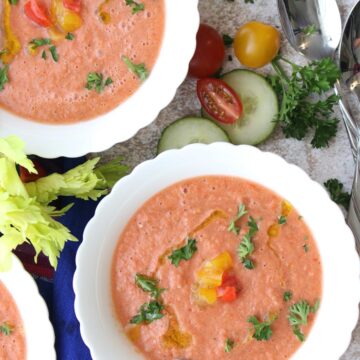 Two bowls of gazpacho in white bowls