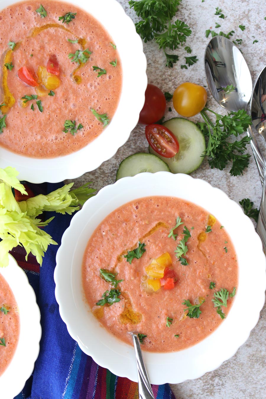 Two bowls of gazpacho in white bowls 