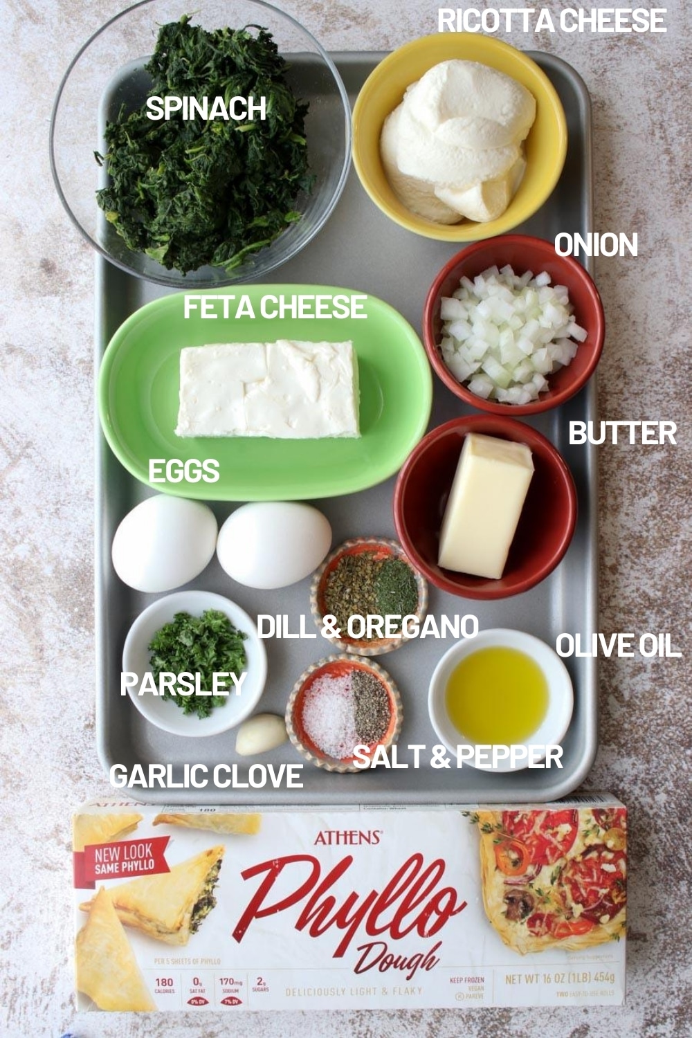 sheet pan with all of the ingredients it takes to make a spinach galette