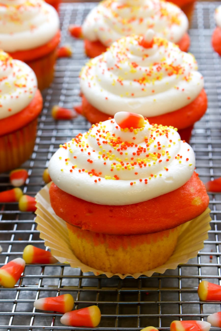 cooling rack with cupcakes and corn candies