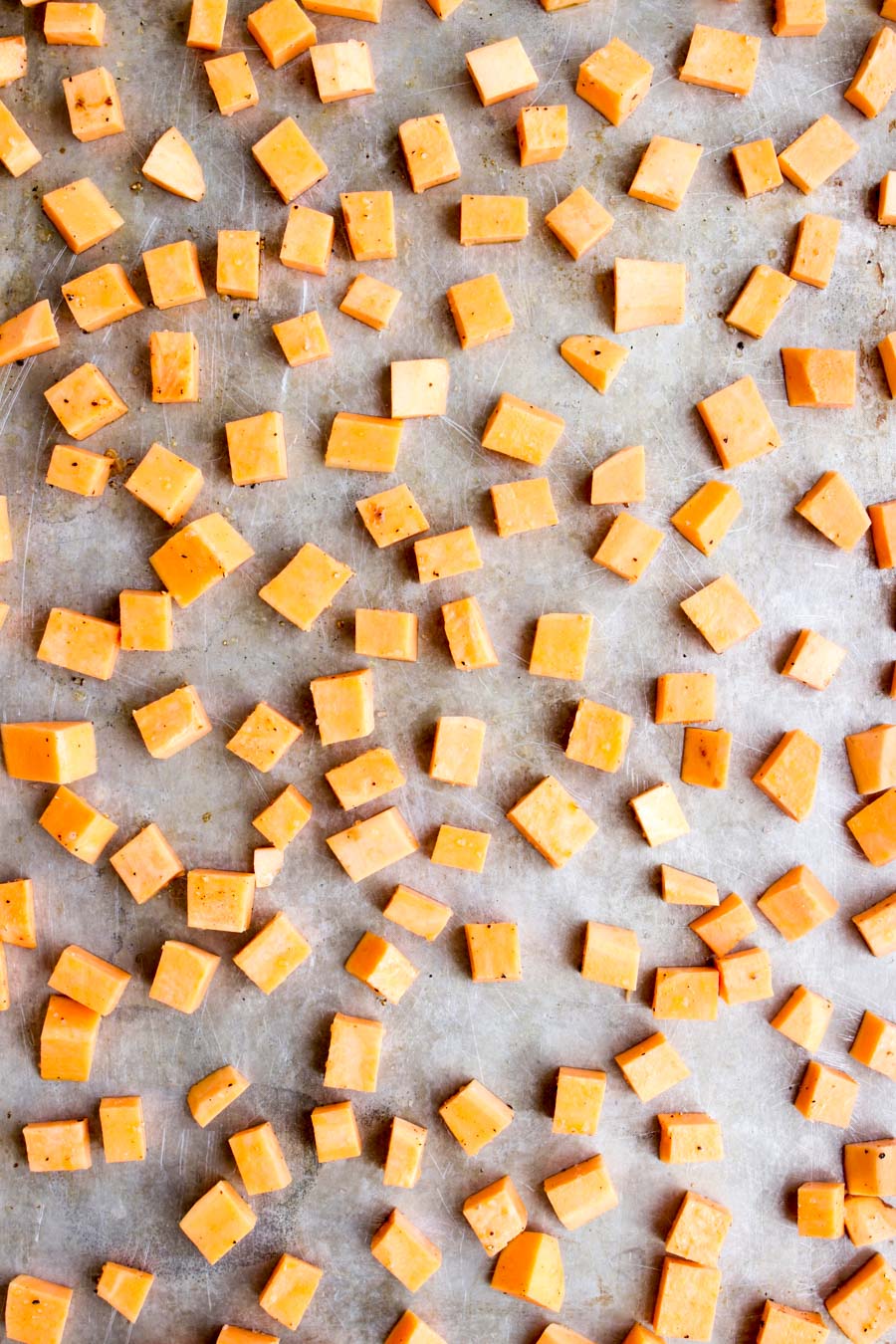 Diced sweet potatoes on a cookie sheet