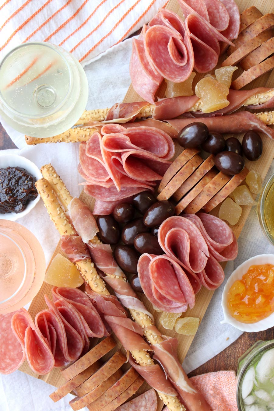 platter of meats and crackers with wine