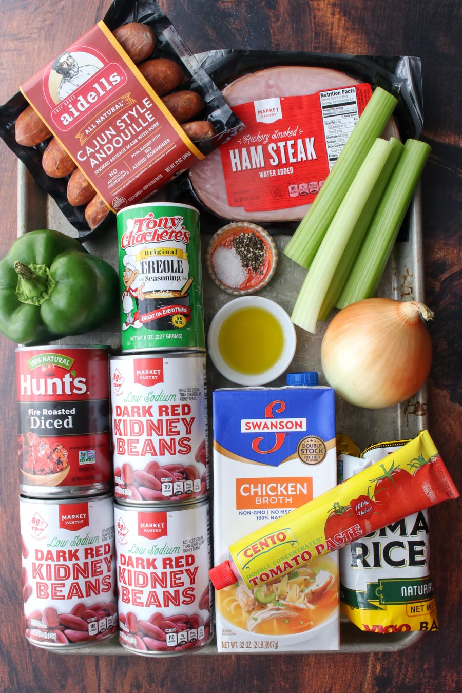 Cookie sheet with all of the ingredients to make red beans and rice