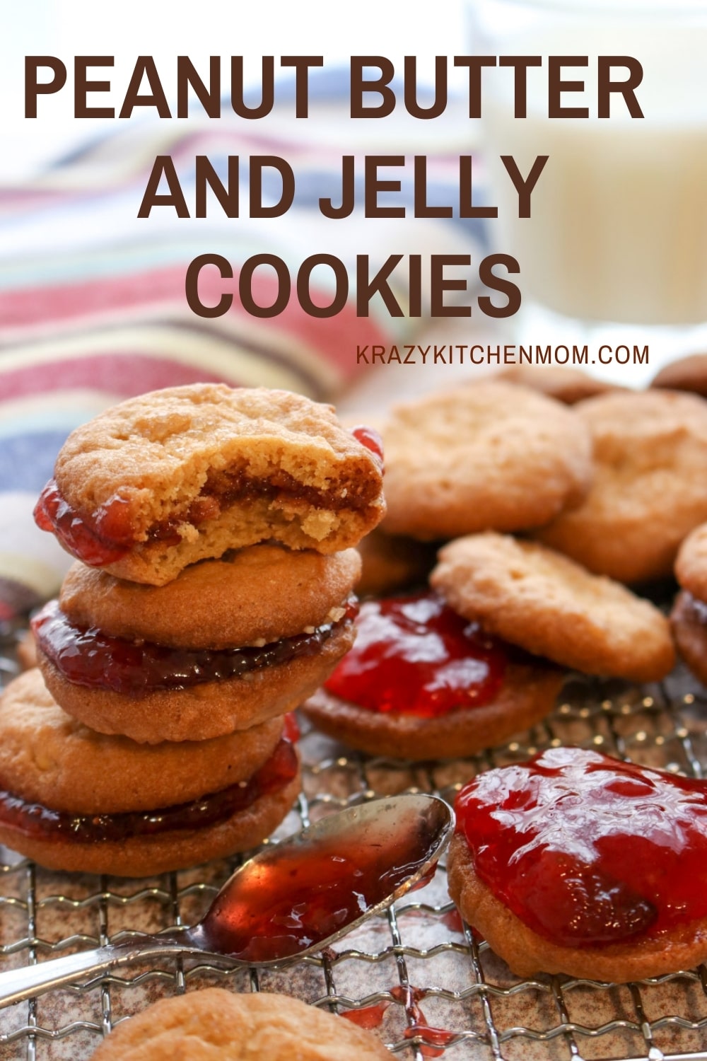 Two peanut butter cookies sandwiched together with grape jelly make the best Peanut Butter and Jelly Cookies. Crunchy, creamy, sweet - everything you remember in a delicious little three-bite cookie. via @krazykitchenmom