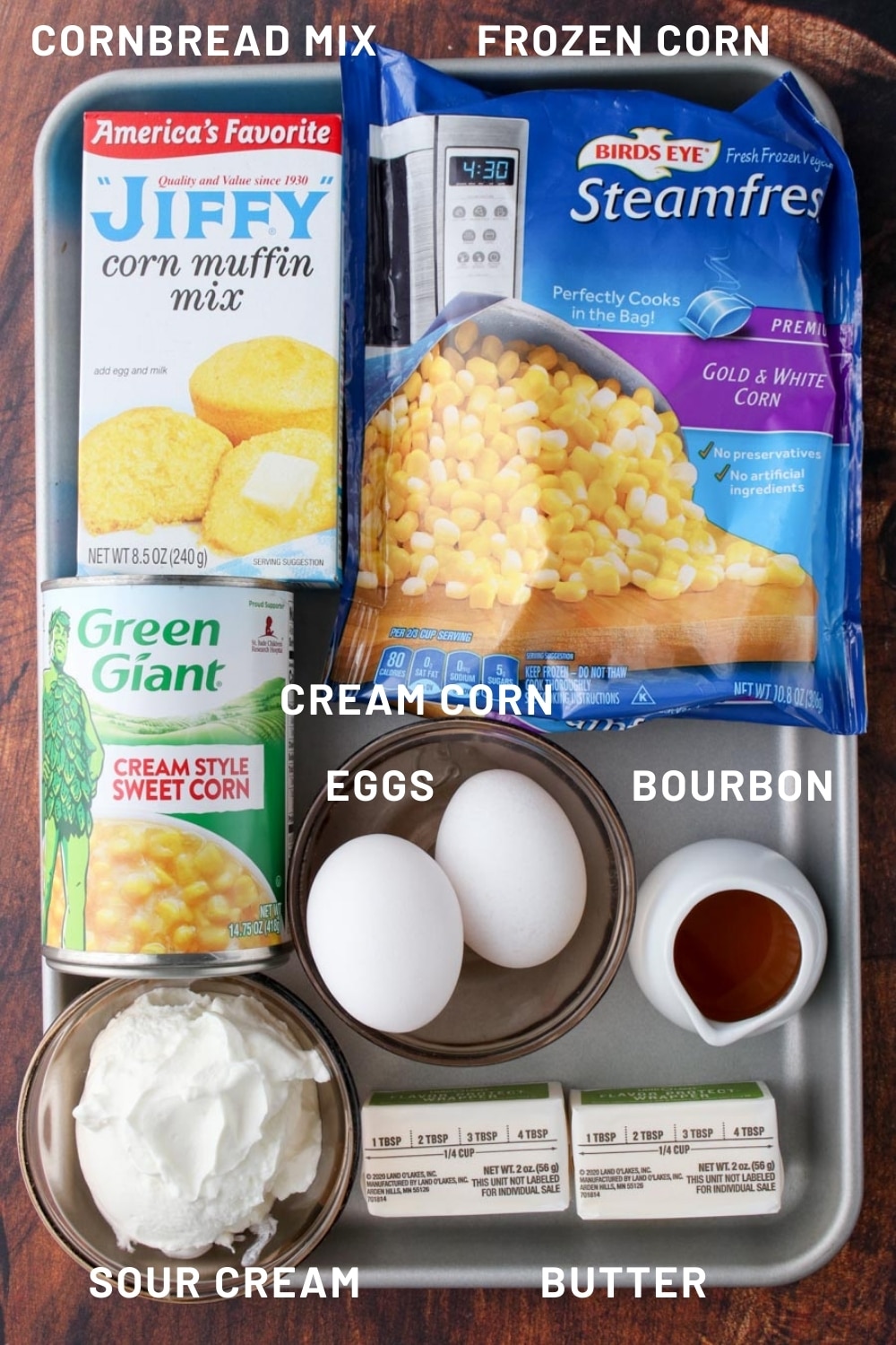 cookie sheet with all of the ingredients needed to make corn pudding