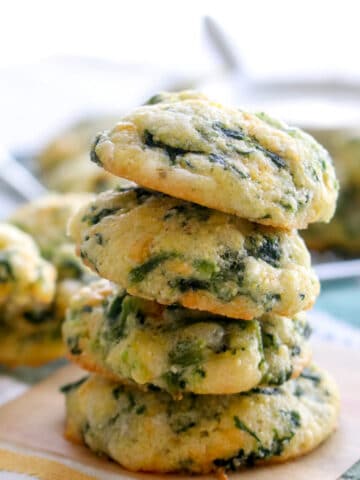 four spinach cheese bites stacked on top of each other