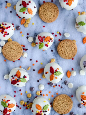Cookies and sprinkles spread out on a marble background