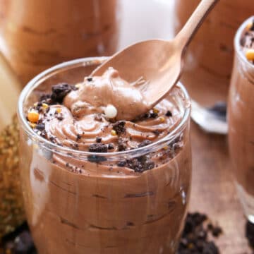 Jar of chocolate hazelnut mousse with spoon in it