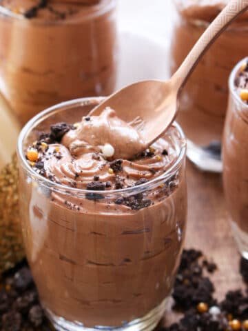 Jar of chocolate hazelnut mousse with spoon in it