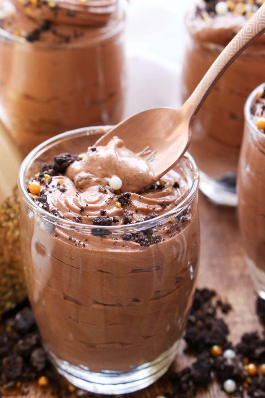 Jar of chocolate hazelnut mousse with spoon in it