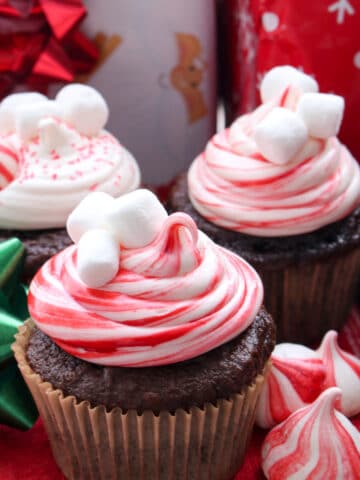 chocolate cupcake decorated with red and white swirl frosting